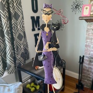 Woman with black cat garden decor